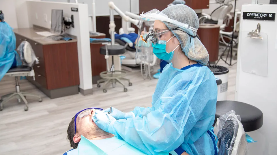 dental hygienist working in dental clinic professional treatment